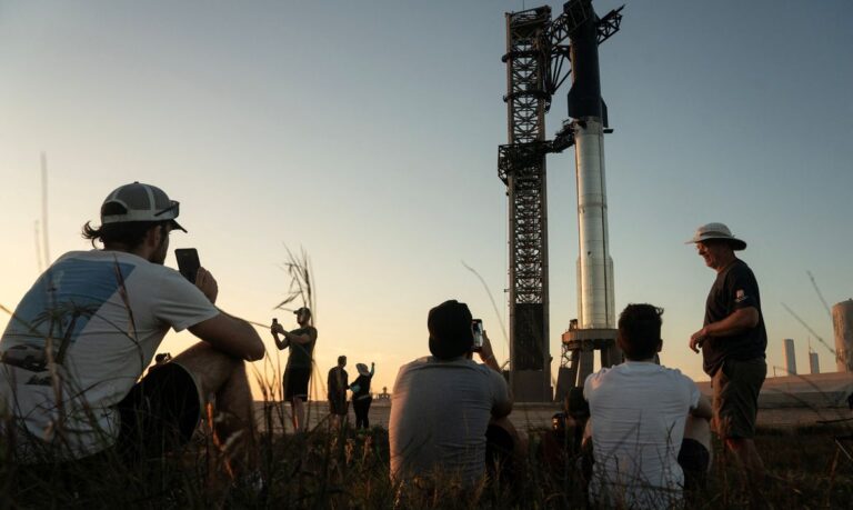 People look on as SpaceX's next-generation Starship spacecraft is prepared for test launch from the company's Boca Chica launchpad near Brownsville, Texas, U.S. November 17, 2023. REUTERS/Go Nakamura