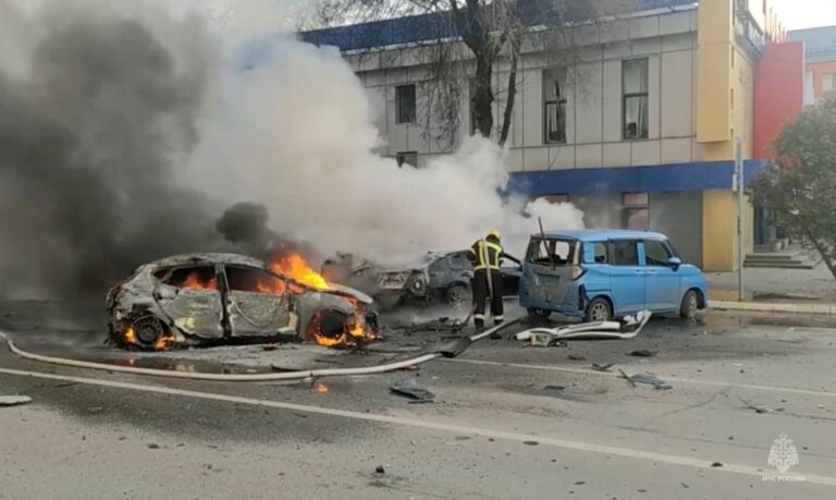 A firefighter works to extinguish a burning car following what was said to be Ukrainian forces' shelling in the course of Russia-Ukraine conflict, in Belgorod, Russia December 30, 2023, in this still image taken from video. Russian Emergencies Ministry/Handout via REUTERS ATTENTION EDITORS - THIS IMAGE HAS BEEN SUPPLIED BY A THIRD PARTY. NO RESALES. NO ARCHIVES. MANDATORY CREDIT.