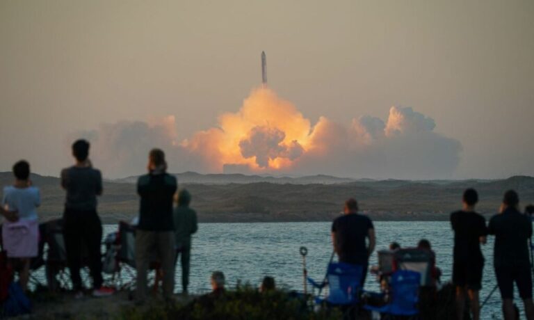People watch as SpaceX's next-generation Starship spacecraft atop its powerful Super Heavy rocket lifts off from the company's Boca Chica launchpad on an uncrewed test flight, as seen from South Padre Island, near Brownsville, Texas, U.S. November 18, 2023. REUTERS/Go Nakamura