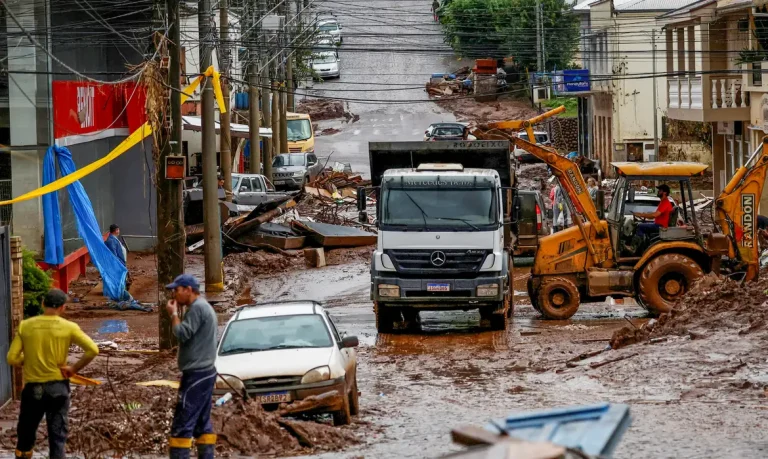 People help to clean houses partially destroyed after floods in Mucum, Rio Grande do Sul state, Brazil May 11, 2024. REUTERS/Adriano Machado