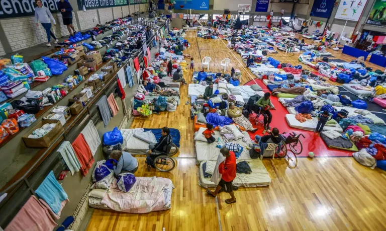 People who have been evacuated from flooded areas rest at a gym used as a shelter in Porto Alegre, Rio Grande do Sul state, Brazil May 10, 2024. REUTERS/Diego Vara