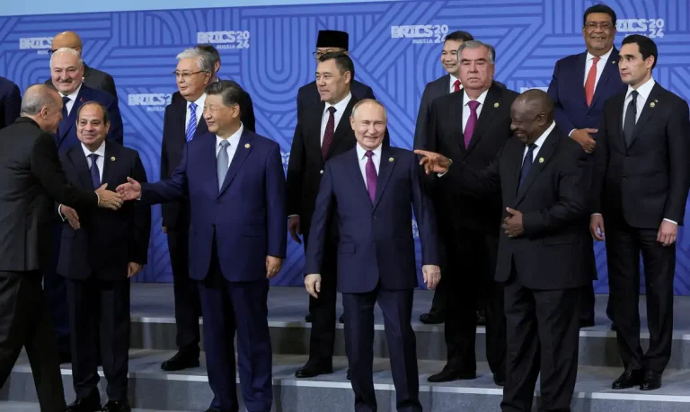 FILE PHOTO: Russian President Vladimir Putin and participants in the outreach/BRICS Plus format meeting pose for a family photo during the BRICS summit in Kazan, Russia, 24 October 2024. MAXIM SHIPENKOV/Pool via REUTERS/File Photo