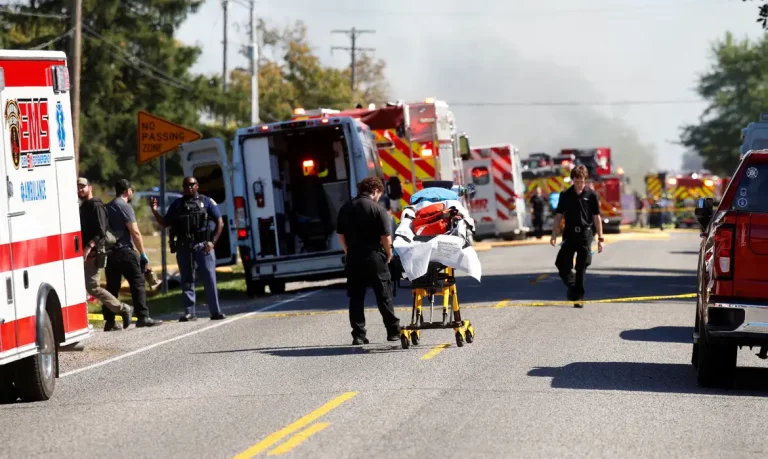 Smoke rises as members of emergency personnel work at the scene of a shooting which took place at the Church of Jesus Christ of Latter-day Saints, according to police, in Grand Blanc, Michigan, U.S., September 28, 2025. REUTERS/Rebecca Cook     TPX IMAGES OF THE DAY
