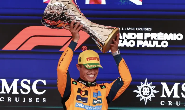 Formula One F1 - Sao Paulo Grand Prix - Autodromo Jose Carlos Pace, Sao Paulo, Brazil - November 9, 2025 McLaren's Lando Norris celebrates on the podium with a trophy after winning the Sao Paulo Grand Prix REUTERS/Jean Carniel