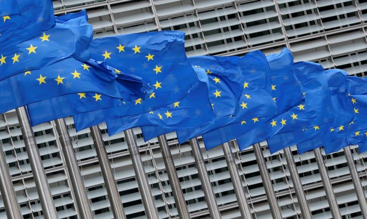 FILE PHOTO: European Union flags flutter outside the European Commission headquarters in Brussels