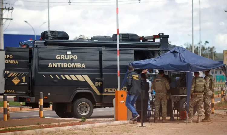 Security forces work as a robot of the federal police bomb squad is seen near what is believed to be an explosive artifact in Brasilia, Brazil, December 24, 2022. REUTERS/Adriano Machado