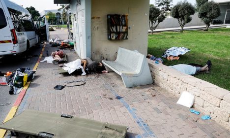 The bodies of people, some of them elderly, lie on a street after they were killed during a mass-infiltration by Hamas gunmen from the Gaza Strip, in Sderot. REUTERS/Ammar Awad