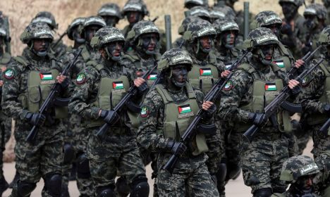 FILE PHOTO: Palestinian Hamas militants take part in a rally marking the 31st anniversary of Hamas' founding, in Gaza City December 16, 2018. REUTERS/Ibraheem Abu Mustafa/File Photo