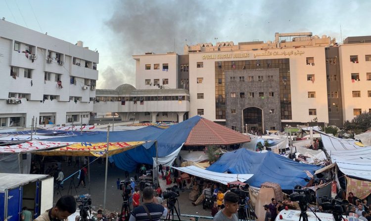 Smoke rises as displaced Palestinians take shelter at Al Shifa hospital, amid the ongoing conflict between Hamas and Israel, in Gaza City, November 8, 2023. REUTERS/Doaa Rouqa