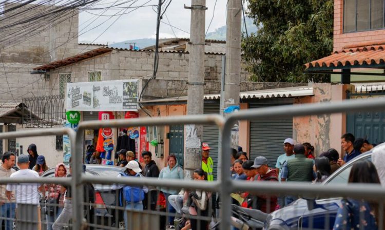 Relatives of inmates await news of their loved ones outside El Inca prison during a security operation due to riots, following the disappearance of Jose Adolfo Macias, alias 'Fito', leader of the Los Choneros criminal group, in Quito, Ecuador, January 8, 2024. REUTERS/Karen Torov