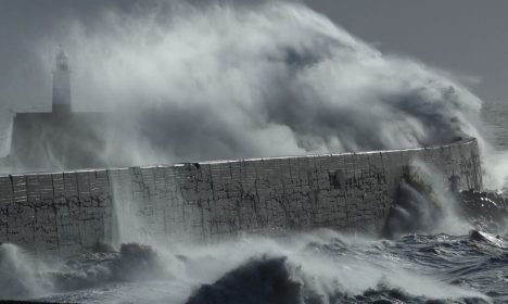 Large waves hit the harbour wall during Storm Isha in Newhaven, southern Britain, January 22, 2024. REUTERS/Toby Melville