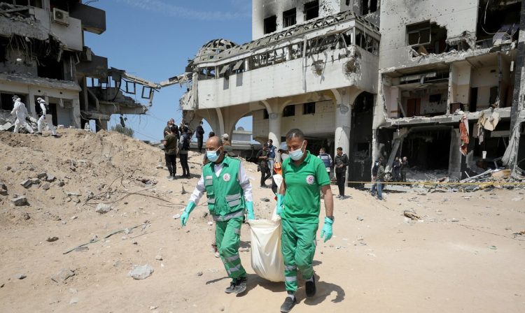 Rescuers and medics search for dead bodies inside the damaged Al Shifa Hospital after Israeli forces withdrew from the hospital and the area around it following a two-week operation, amid the ongoing conflict between Israel and Hamas, in Gaza City April 8, 2024. REUTERS/Dawoud Abu Alkas