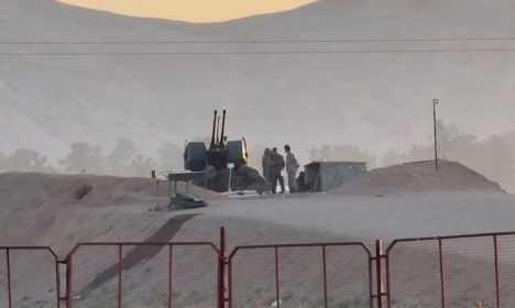 Military personnel stand guard at a nuclear facility in the Zardanjan area of Isfahan, Iran, April 19, 2024, in this screengrab taken from video.  WANA (West Asia News Agency) via REUTERS   ATTENTION EDITORS - THIS PICTURE WAS PROVIDED BY A THIRD PARTY. IRAN OUT. NO COMMERCIAL OR EDITORIAL SALES IN IRAN