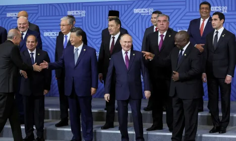 FILE PHOTO: Russian President Vladimir Putin and participants in the outreach/BRICS Plus format meeting pose for a family photo during the BRICS summit in Kazan, Russia, 24 October 2024. MAXIM SHIPENKOV/Pool via REUTERS/File Photo