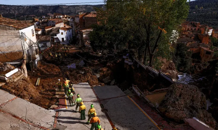 Firefighters gather after heavy rains caused flooding, in Letur, Spain, October 30, 2024. REUTERS/Susana Vera