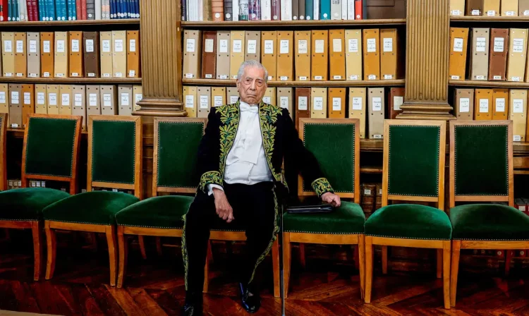 FILE PHOTO: Mario Vargas Llosa, Peruvian writer and Nobel Prize winner, dressed in the traditional attire of French Academicians with his ceremonial epee, poses in the library of the Institut de France before the ceremony during which he will be inducted into the Academie Francaise (French Academy) as an 'Immortal' member, in Paris, France, February 9, 2023.  REUTERS/Sarah Meyssonnier/File Photo
