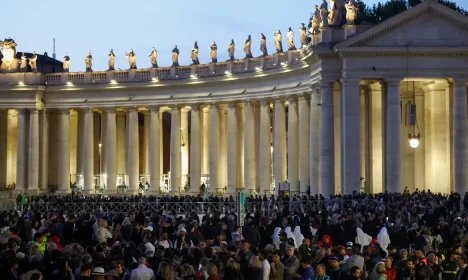Faithful queue to enter St. Peter's Basilica to pay respects as Pope Francis lies in state, as seen from Rome, Italy, April 23, 2025. REUTERS/Hannah McKay
