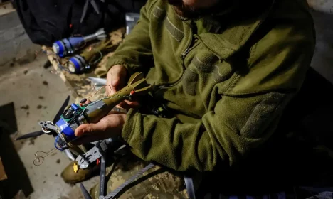 Nazar, 33, a Ukrainian serviceman of the 72nd Chorni Zaporozhtsi Separate Mechanized Brigade of the Ukrainian Armed Forces, prepares a first-person view (FPV) drone to launch it towards Russian troops, during the unilaterally proposed three-day ceasefire declared by Russia, amid Russia's attack on Ukraine, near a frontline in Dnipropetrovsk region, Ukraine May 8, 2025. REUTERS/Alina Smutko