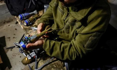 Nazar, 33, a Ukrainian serviceman of the 72nd Chorni Zaporozhtsi Separate Mechanized Brigade of the Ukrainian Armed Forces, prepares a first-person view (FPV) drone to launch it towards Russian troops, during the unilaterally proposed three-day ceasefire declared by Russia, amid Russia's attack on Ukraine, near a frontline in Dnipropetrovsk region, Ukraine May 8, 2025. REUTERS/Alina Smutko