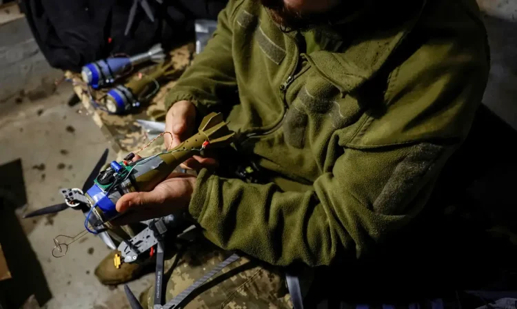 Nazar, 33, a Ukrainian serviceman of the 72nd Chorni Zaporozhtsi Separate Mechanized Brigade of the Ukrainian Armed Forces, prepares a first-person view (FPV) drone to launch it towards Russian troops, during the unilaterally proposed three-day ceasefire declared by Russia, amid Russia's attack on Ukraine, near a frontline in Dnipropetrovsk region, Ukraine May 8, 2025. REUTERS/Alina Smutko