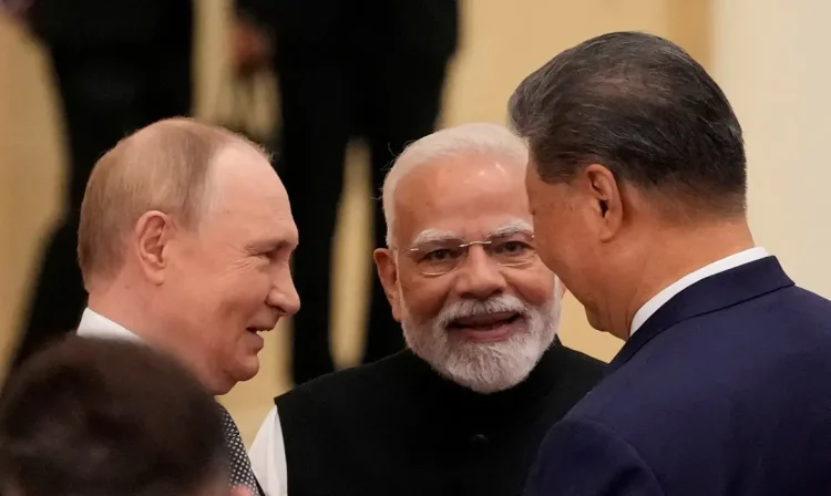 FILE PHOTO: Indian Prime Minister Narendra Modi talks with Russian President Vladimir Putin and Chinese President Xi Jinping ahead of the Shanghai Cooperation Organization (SCO) Summit 2025 at the Meijiang Convention and Exhibition Centre in Tianjin, China, September 1, 2025.  SUO TAKEKUMA/Pool via REUTERS/File Photo