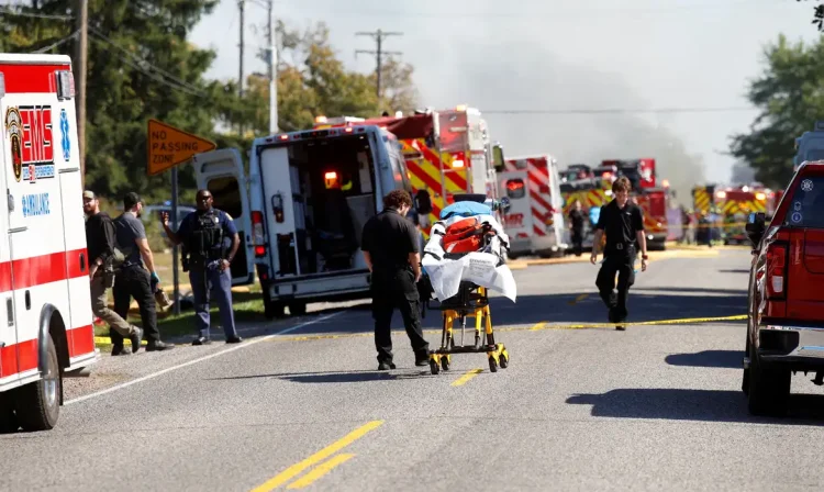 Smoke rises as members of emergency personnel work at the scene of a shooting which took place at the Church of Jesus Christ of Latter-day Saints, according to police, in Grand Blanc, Michigan, U.S., September 28, 2025. REUTERS/Rebecca Cook     TPX IMAGES OF THE DAY
