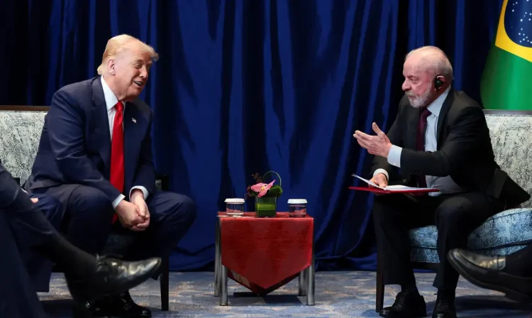 U.S. President Donald Trump and Brazilian President Luiz Inacio Lula da Silva talk as they meet on the sidelines of the 47th Association of Southeast Asian Nations (ASEAN) summit in Kuala Lumpur, Malaysia, October 26, 2025. REUTERS/Evelyn Hockstein