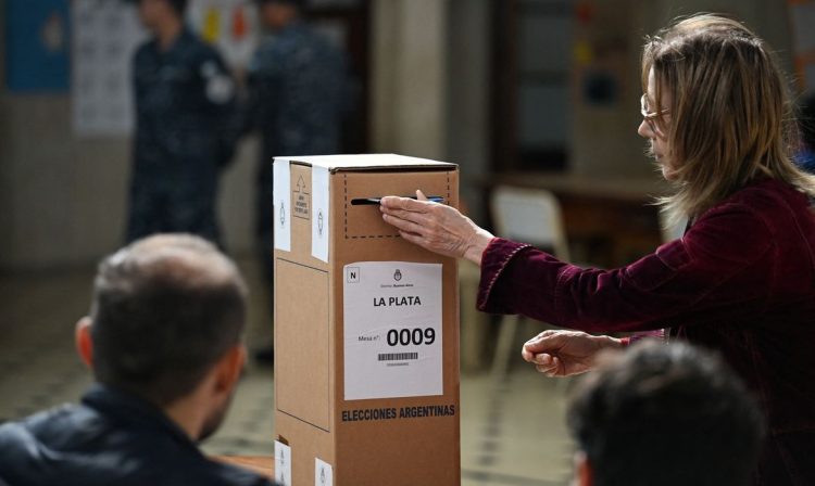 A woman votes at a polling station during the midterm election, in La Plata, Buenos Aires, Argentina, October 26, 2025. REUTERS/Martin Cossarini