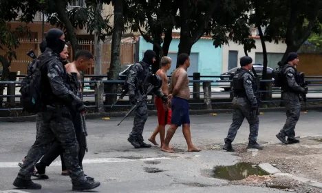 2025-10-28t154639z_743868207_rc23lhasao1q_rtrmadp_3_brazil-violence Members of the military police special unit detain suspected drug dealers during a police operation against drug trafficking at the favela do Penha, in Rio de Janeiro, Brazil October 28, 2025. REUTERS/Aline Massuca