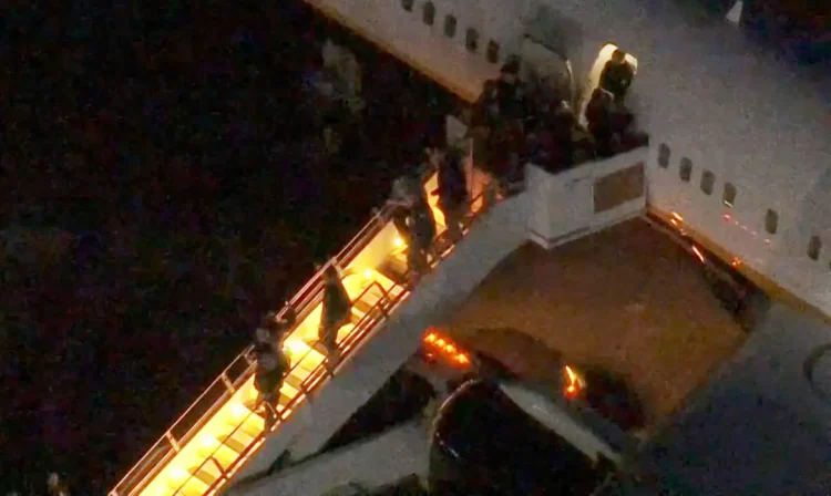 Venezuela's President Nicolas Maduro is led in custody from a U.S. federal airplane before his scheduled court appearance at Manhattan federal court, at Stewart Air National Guard Base in Newburgh, New York, U.S. January 3, 2026.  ABC Affiliate WABC via REUTERS 
NO RESALES. NO ARCHIVES. THIS IMAGE HAS BEEN SUPPLIED BY A THIRD PARTY. MANDATORY CREDIT