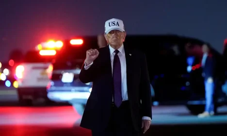 U.S. President Donald Trump pumps his fist after disembarking Air Force One at Palm Beach International Airport in West Palm Beach, Florida, U.S., February 27, 2026. REUTERS/Elizabeth Frantz