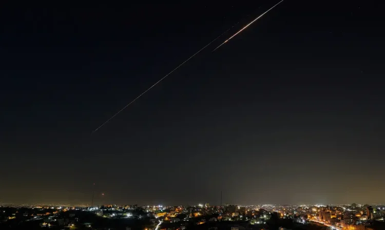 An Iranian missile flies towards Israel, amid the U.S.-Israeli conflict with Iran, as seen from Hebron, in the Israeli-occupied West Bank, March 27, 2026. REUTERS/Mussa Qawasma