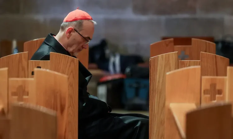 Cardinal Pierbattista Pizzaballa, the Latin Patriarch of Jerusalem, sits in the Church of All Nations on the day of a prayer service to mark Palm Sunday, following the cancellation of the traditional Palm Sunday procession from the Mount of Olives, amid restrictions on gathering in large groups and the U.S.-Israeli conflict with Iran, in Jerusalem, March 29, 2026. REUTERS/Ammar Awad/Pool     TPX IMAGES OF THE DAY