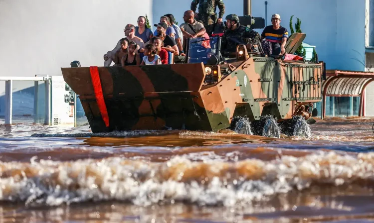 A military vehicle transports evacuees near the airport in Porto Alegre, Rio Grande do Sul, Brazil, May 6, 2024. REUTERS/Diego Vara