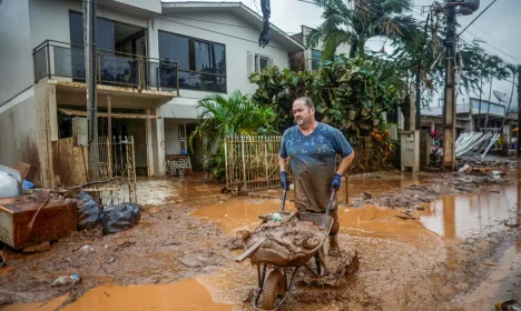 Casiano Baldasso cleans his house that was partially destroyed after the floods in Mucum, Rio Grande do Sul state, Brazil May 11, 2024. REUTERS/Adriano Machado