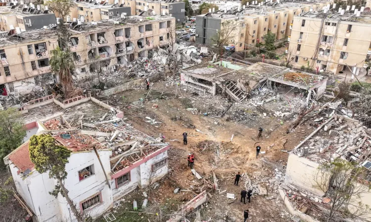 A drone view shows a damage in a residential neighbourhood, following a night of Iranian missile strikes which injured dozens of Israelis, amid the U.S.-Israel conflict with Iran, in Dimona, southern Israel March 22, 2026. REUTERS/Roei Kastro     TPX IMAGES OF THE DAY