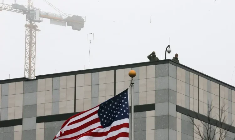 epa04112575 US security service soldiers stand on a roof of the American embassy in Kiev, Ukraine, 06 March 2014. Crimea's parliament moved the date of all-Crimean referendum on the status of the Autonomous Republic of Crimea to 16 March. Military observers from the Organization for Security and Co-operation in Europe (OSCE) have been stopped from entering Ukraine's Crimea peninsula at a checkpoint set up by pro-Russian militia, diplomats said in Vienna on 06 March.  EPA/SERGEY DOLZHENKO