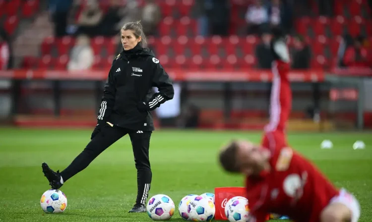 FILE PHOTO: Soccer Football - Bundesliga - 1. FC Union Berlin v FC Augsburg - Stadion An der Alten Forsterei, Berlin, Germany - November 25, 2023 1. FC Union Berlin assistant coach Marie-Louise Eta during the warm up before the match REUTERS/Annegret Hilse /File Photo NO RESALES. NO ARCHIVES