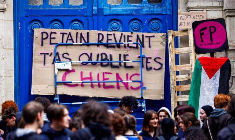 French high school students block the access to the Lycee Voltaire highschool in Paris to protest against the rise of far-right parties, after French far-right win in European Parliament vote and ahead of early legislative elections in France, June 11, 2024. The placard reads